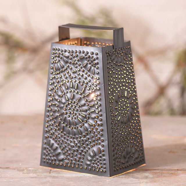https://www.irvins.com/mm5/graphics/00000001/cheese-grater-tabletop-accent-light-in-black-punched-tin-k16-19_640x640.jpg
