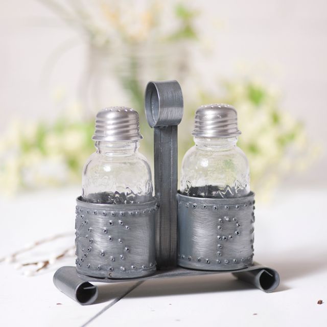 https://www.irvins.com/mm5/graphics/00000001/salt-and-pepper-shaker-holder-in-antique-punched-tin-k18-67bz_640x640.jpg